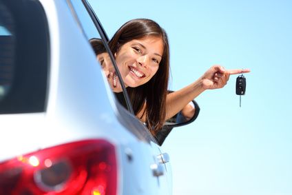 Driver holding a new car key after automotive locksmith service in Bethesda